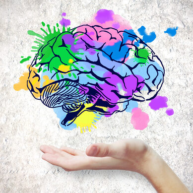 Hand,Holding,Colorful,Brain,Sketch,On,Concrete,Background.,Creative,Mind
